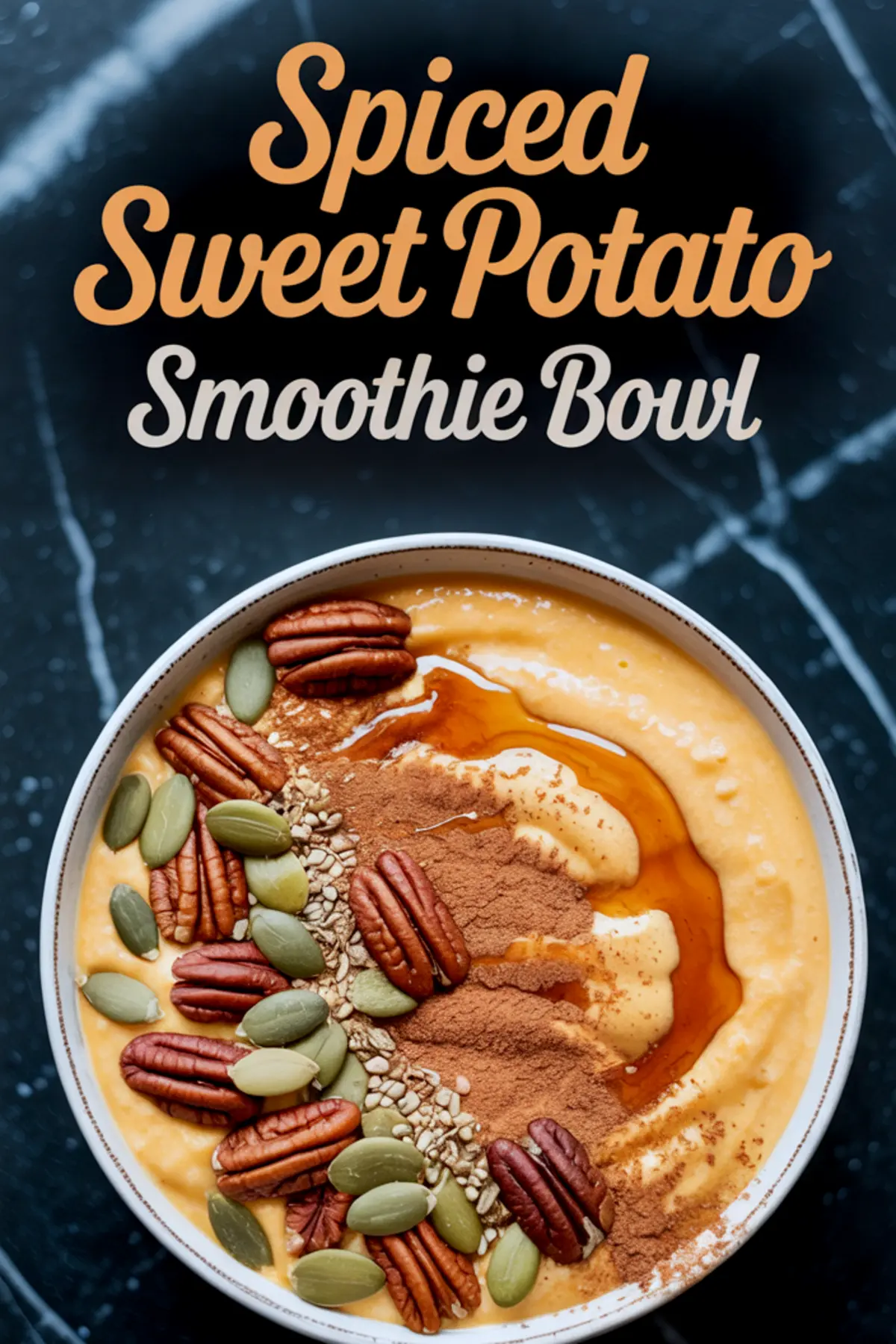 Spiced sweet potato smoothie bowl topped with pecans, pumpkin seeds, flax seeds, cinnamon, and a drizzle of maple syrup, placed on a dark marble surface with text overlay.