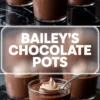 Glass pots filled with smooth Baileys chocolate dessert, topped with whipped cream and cocoa dusting, arranged on a glossy black surface. One foreground cup shows a spoon dipped into the mousse, emphasizing its silky consistency.
