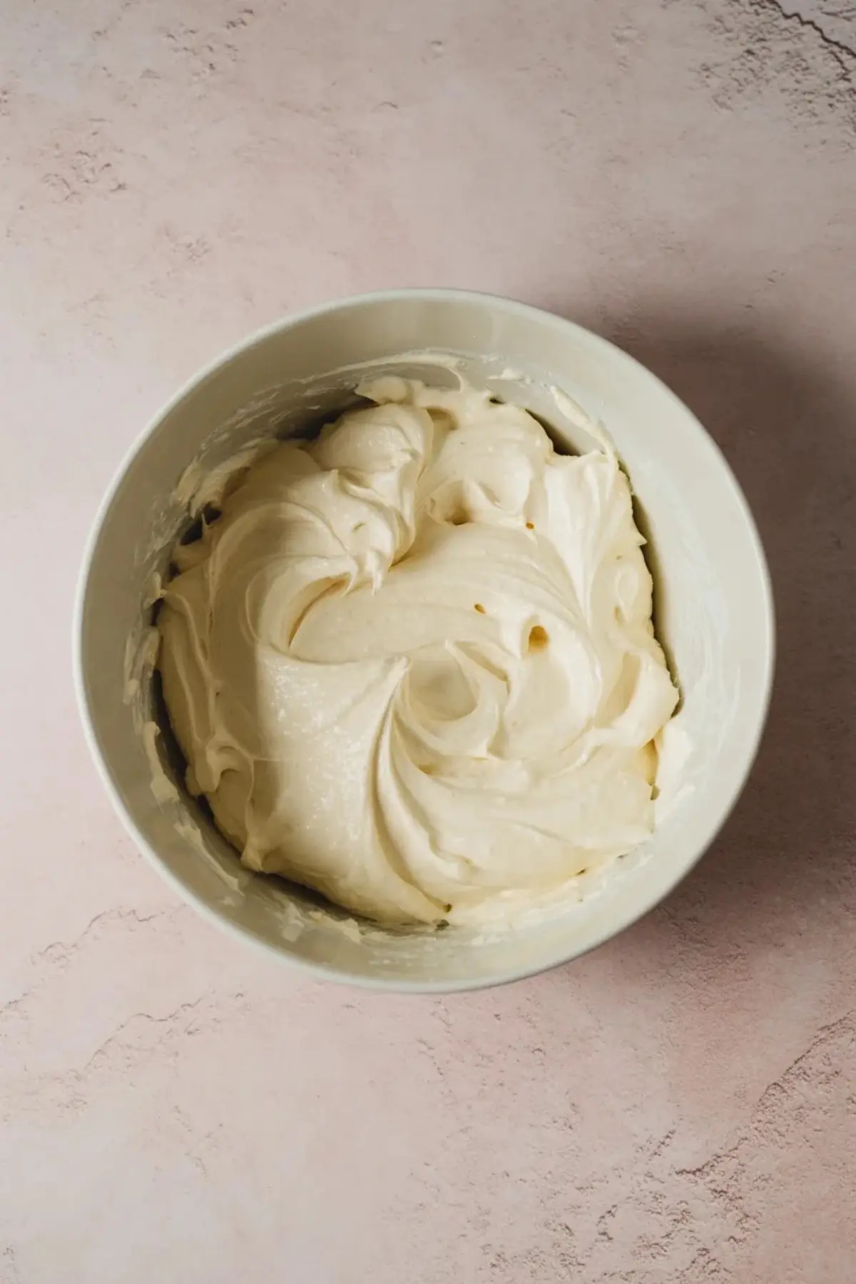 Creamy coconut vanilla filling is spread into the pan over the graham crust for coconut cream pie bars.